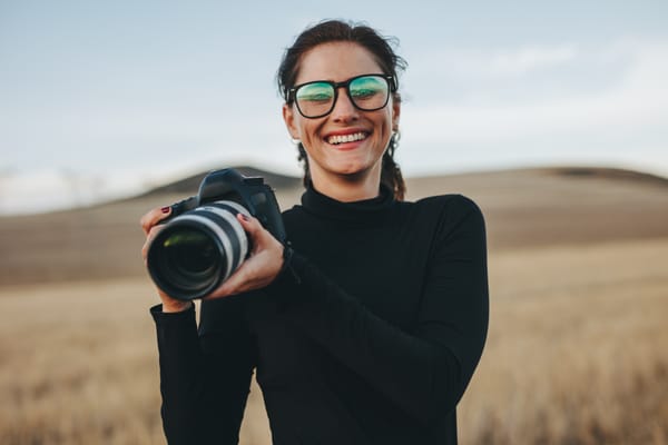Female photographer holding a camera