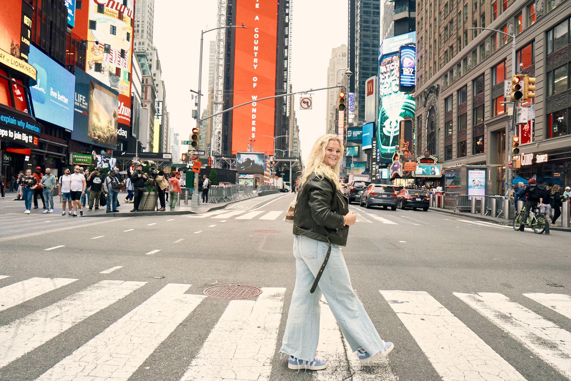 Woman using zebra crossing in Times Square