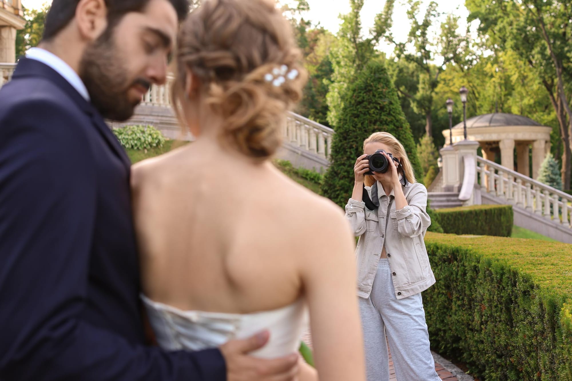 Wedding photographer taking a photo of the bride and groom